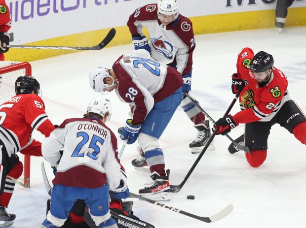 Blackhawks defenseman Jaycob Megna (24) attempts to gain control of the puck against the Avalanche at the United Center on February 29, 2024.  (John J. Kim/Chicago Tribune)