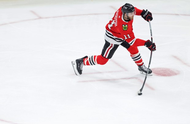 Blackhawks right winger Taylor Raddysh (11) takes a shot on goal during the second period against the Avalanche at the United Center on Feb. 29, 2024.  (John J. Kim/Chicago Tribune)