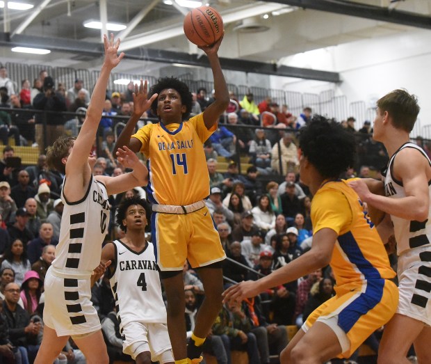 De La Salle's Charles Barnes (14) takes a shot against Mount Carmel during the Class 3A Hinsdale South Regional final on Friday, March 1, 2024 in Darien, IL.  (Steve Johnston/Daily Southtown)