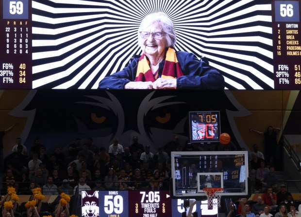 A photo of Sister Jean Dolores Schmidt is displayed hopefully to distract a Dayton free throw shooter in the second half at Gentile Arena on March 1, 2024.  (John J. Kim/Chicago Tribune)