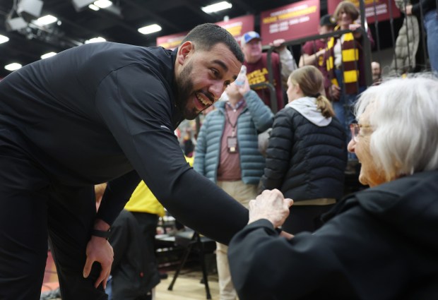 Loyola coach Drew Valentine celebrates with Sister Jean Dolores Schmidt after the 77-72 victory over Dayton at Gentile Arena on March 1, 2024.  (John J. Kim/Chicago Tribune)