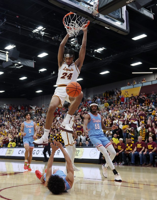 Loyola center Miles Rubin (24) dunks over Dayton guard Javon Bennett (0) during the first half at Gentile Arena on March 1, 2024.  The basket did not count.  (John J. Kim/Chicago Tribune)