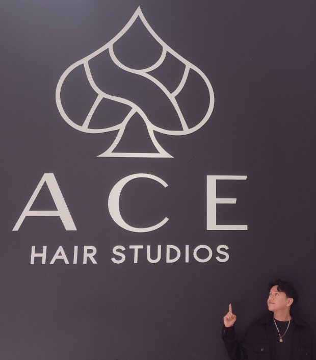 Emilio Chavez opened his new barbershop, Ace Hair Studios, in downtown Elgin with partner Arnold Noraky in January.  (Mike Danahey/Courier News)