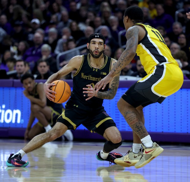 Northwestern guard Boo Buie (0) makes a move during the first half of the game against Iowa on March 2, 2024 at Welsh-Ryan Arena in Evanston.  (Chris Sweda/Chicago Tribune)