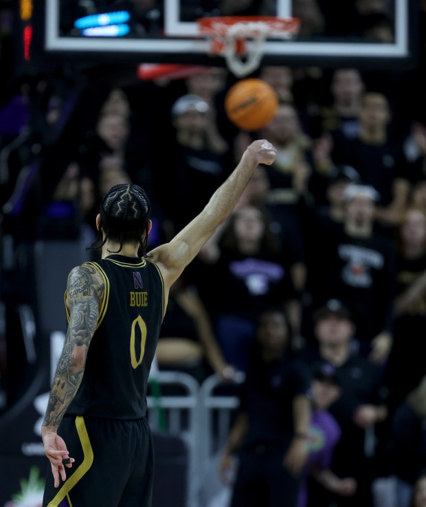 Northwestern guard Boo Buie (0) makes a 3-pointer in the second half against Iowa at Welsh-Ryan Arena in Evanston on March 2, 2024.  (Chris Sweda/Chicago Tribune)