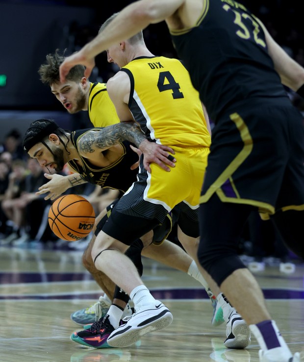Northwestern guard Boo Buie (0) loses the ball in the first half against Iowa on March 2, 2024 at Welsh-Ryan Arena in Evanston.  (Chris Sweda/Chicago Tribune)