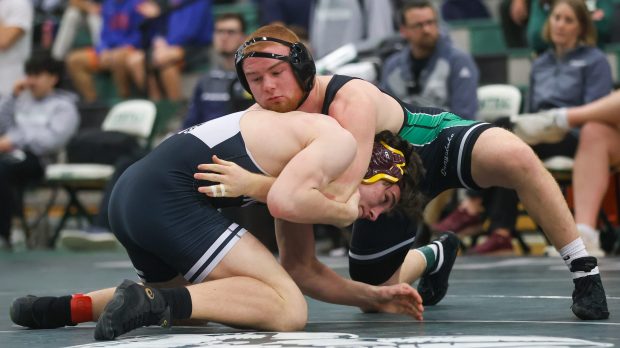 Grayslake Central's Matty Jens and Fenwick's Patrick Gilboy wrestle in the 175-pound 1st-place match at the Class 2A Grayslake Central Sectionals on Saturday, Feb. 10, 2024, in Grayslake.  (Troy Stolt for News-Sun)