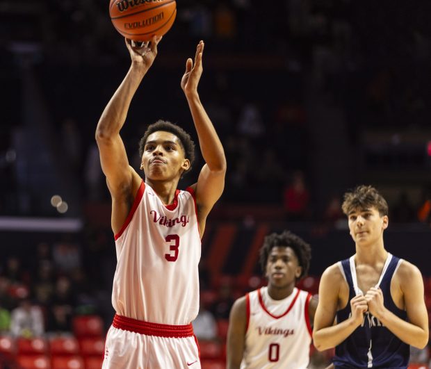 Homewood-Flossmoor's Caleb Chavers (3) makes his second free throw in the final seconds of the Class 4A state semifinal game against New Trier on Friday, March 8, 2024, at the State Farm Center in Champaign.  (Vincent D. Johnson/for) Daily Southtown)