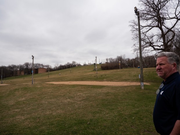 Mike Toohey, recreation/area manager for Four Lakes Alpine Snowsports in Lisle, looks over at the Four Lakes ski trail, which closed for the season on March 7, 2024.  (Tess Kenny/Naperville Sun)