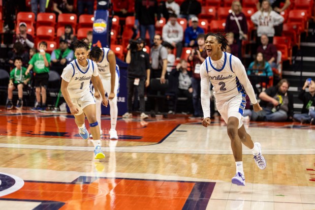 Phillips' Amari Edwards (1) and Lawrence Horton (2) run the length of the field after winning the Class 2A state championship game with a 54-47 win over Benton on Saturday, March 9, 2024, at State Farm Center in Champaign.  (Vincent D. Johnson) /For Daily Southtown)