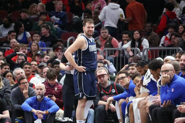 Mavericks guard Luka Doncic (77) leaves the game with his team comfortably ahead of the Bulls in the second half at the United Center in Chicago on March 11, 2024.  (Terrence Antonio James/Chicago Tribune)