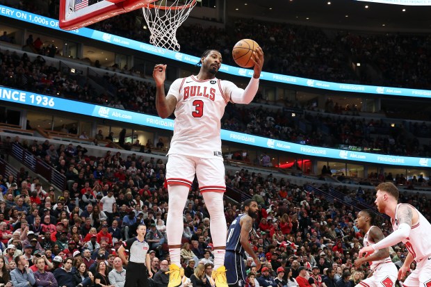 Bulls center Andre Drummond (3) grabs a rebound in the second half against the Mavericks at the United Center in Chicago on March 11, 2024.  (Terrence Antonio James/Chicago Tribune)