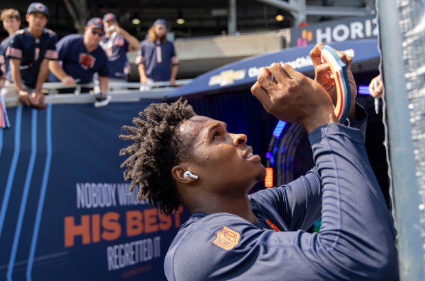 Bears wide receiver Darnell Mooney signs autographs for fans before the game against the Packers at Soldier Field on September 10, 2023.  (Brian Cassella/Chicago Tribune)