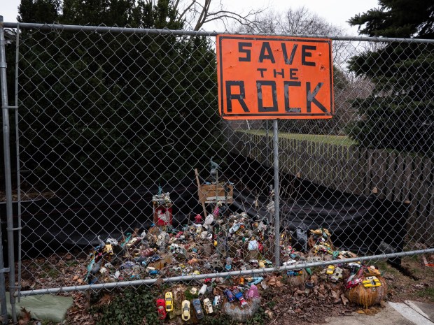 a sign "Save the Rock" 711 N. Brainard St. in Naperville as a developer prepares to demolish the house there and build something new.  It was placed in front of the property at.  (Tess Kenny/Naperville Sun)