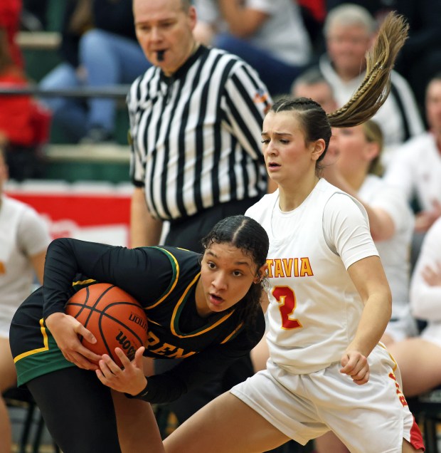 Fremd's Coco Urlacher (11) receives the ball from Batavia's Brooke Carlson (2) during the fourth quarter of the Class 4A Bartlett Supersectional on Monday, Feb. 26, 2024, in Bartlett.  Batavia lost 65-46.  H. Rick Bamman / For Beacon News