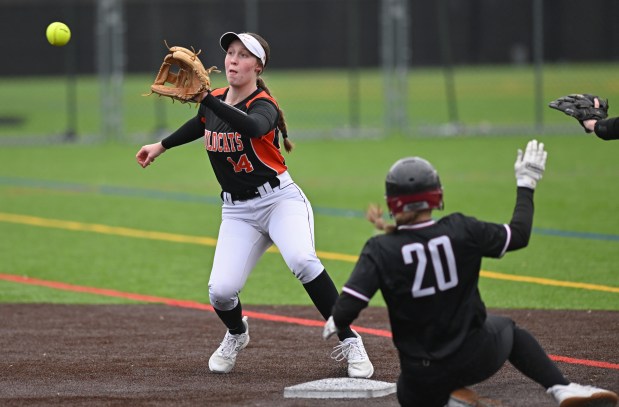 Libertyville's Zoe Kinsella (14) throws a pitch but is too late to catch Antioch's Samanth Hillner (20) at 2nd base in the 2nd inning of the game on Wednesday, March 13, 2024.  Antakya won the match 15-1 after 5 shots.  .  (Brian O'Mahoney for News-Sun)