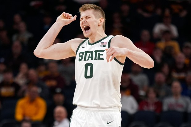 Michigan State forward Jaxon Kohler celebrates after teammate Malik Hall's dunk in the first half against Minnesota in the second round of the Big Ten Tournament on Thursday, March 14, 2024, in Minneapolis.  (Abbie Parr/AP)