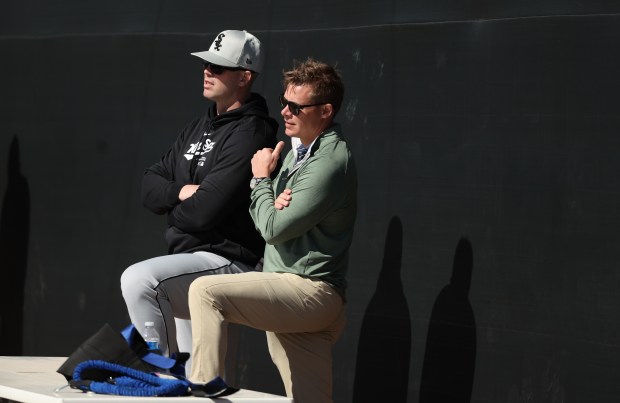 White Sox general manager Chris Getz (R) watches a practice at Camelback Ranch in Glendale, Arizona, on February 21, 2024 (Stacey Wescott/Chicago Tribune)